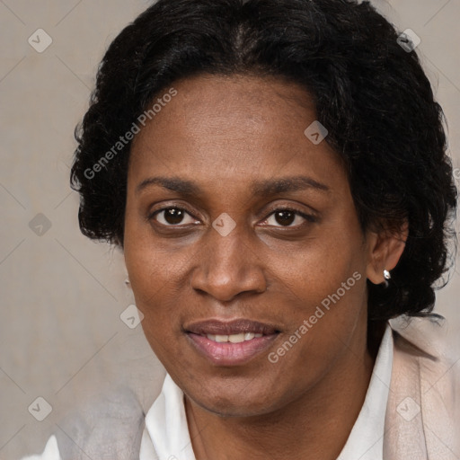 Joyful black adult female with short  brown hair and brown eyes