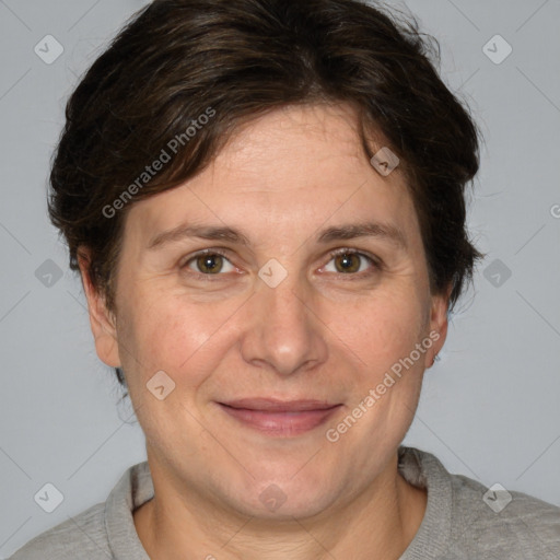 Joyful white adult female with short  brown hair and grey eyes