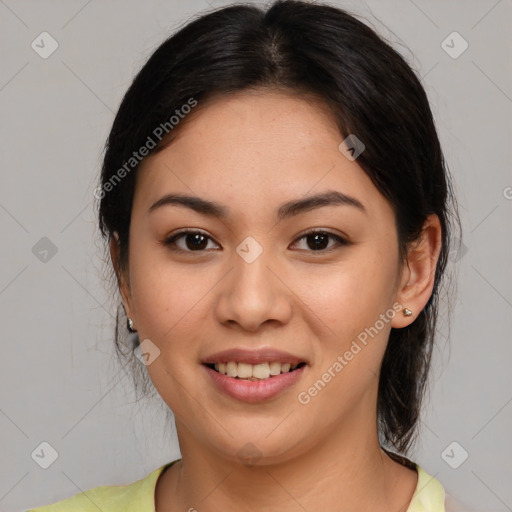 Joyful latino young-adult female with medium  brown hair and brown eyes