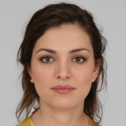 Neutral white young-adult female with medium  brown hair and brown eyes