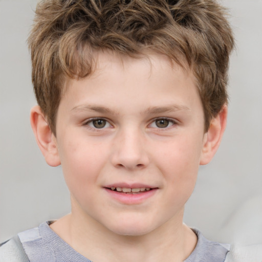 Joyful white child male with short  brown hair and grey eyes