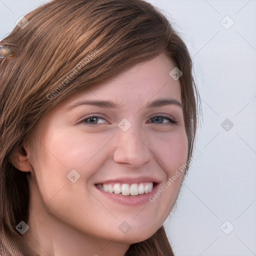 Joyful white young-adult female with long  brown hair and blue eyes