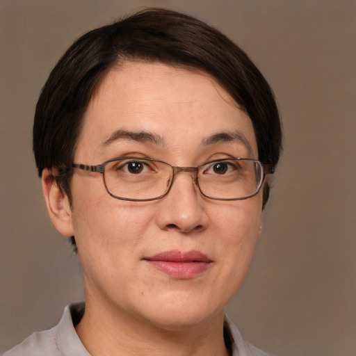 Joyful white adult female with short  brown hair and brown eyes