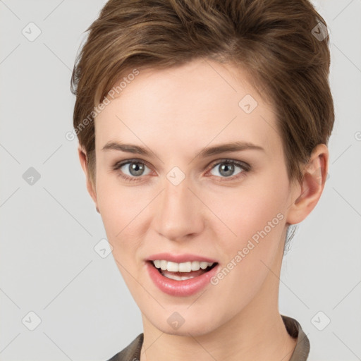 Joyful white young-adult female with short  brown hair and grey eyes