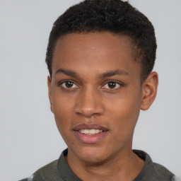 Joyful black young-adult male with short  brown hair and brown eyes