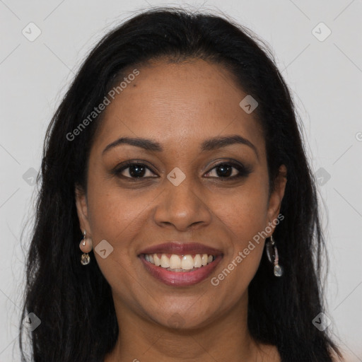 Joyful black young-adult female with long  brown hair and brown eyes