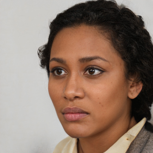 Neutral latino young-adult female with short  brown hair and brown eyes