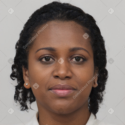 Joyful black young-adult female with long  brown hair and brown eyes