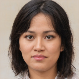 Neutral asian young-adult female with medium  brown hair and brown eyes