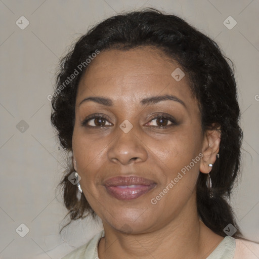 Joyful black adult female with medium  brown hair and brown eyes