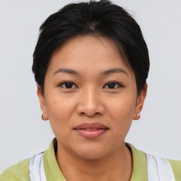 Joyful asian young-adult female with short  brown hair and brown eyes