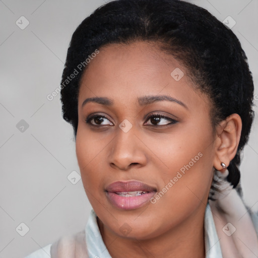 Joyful black young-adult female with short  brown hair and brown eyes