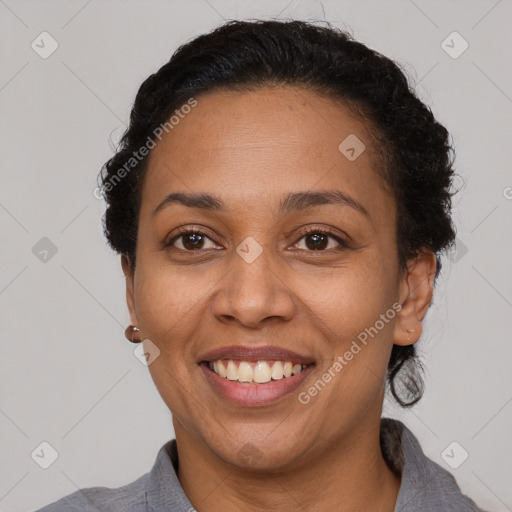 Joyful latino adult female with short  brown hair and brown eyes