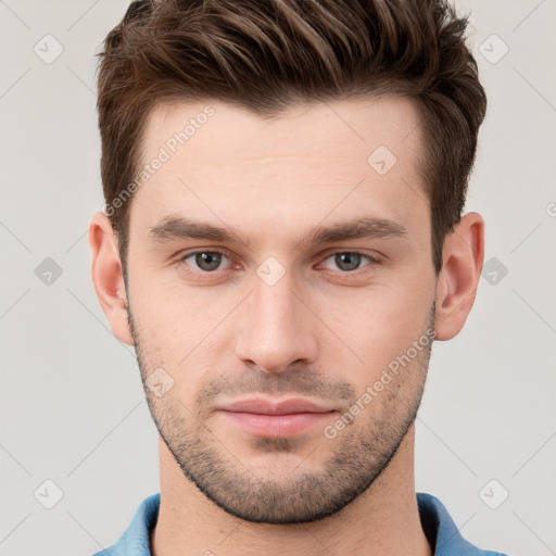 Neutral white young-adult male with short  brown hair and grey eyes