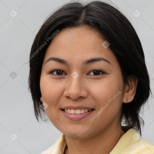 Joyful asian young-adult female with medium  brown hair and brown eyes