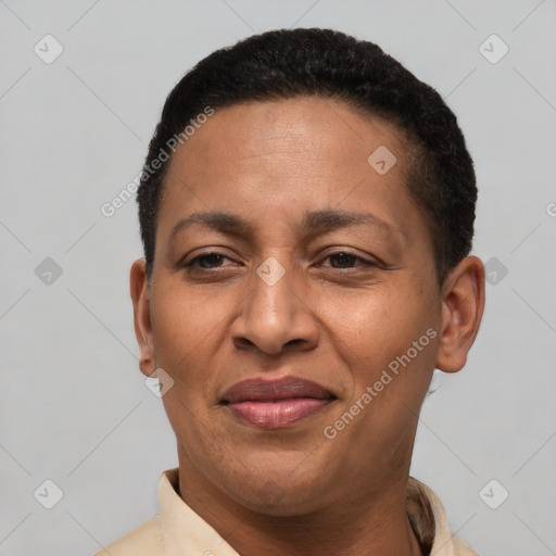 Joyful latino adult female with short  brown hair and brown eyes