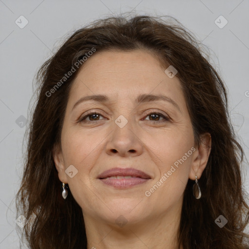 Joyful white adult female with long  brown hair and brown eyes