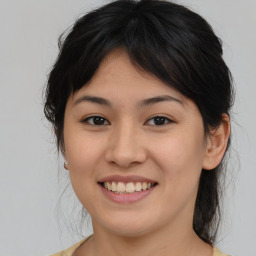 Joyful asian young-adult female with medium  brown hair and brown eyes