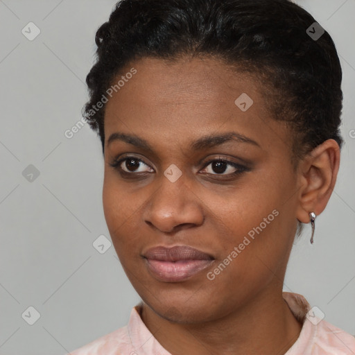 Joyful black young-adult female with short  brown hair and brown eyes