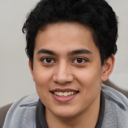 Joyful latino young-adult male with short  brown hair and brown eyes