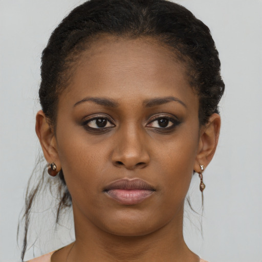 Neutral black young-adult female with short  brown hair and brown eyes