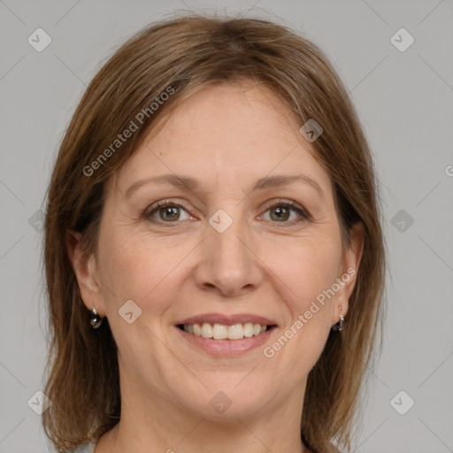 Joyful white adult female with medium  brown hair and grey eyes