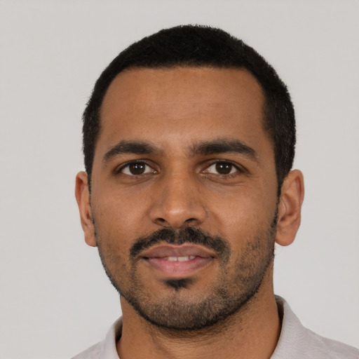 Neutral black young-adult male with short  black hair and brown eyes
