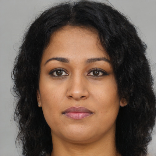 Neutral latino young-adult female with long  black hair and brown eyes