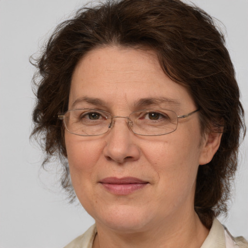 Joyful white middle-aged female with medium  brown hair and brown eyes