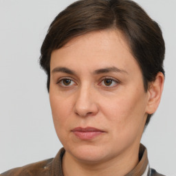 Joyful white adult female with short  brown hair and brown eyes