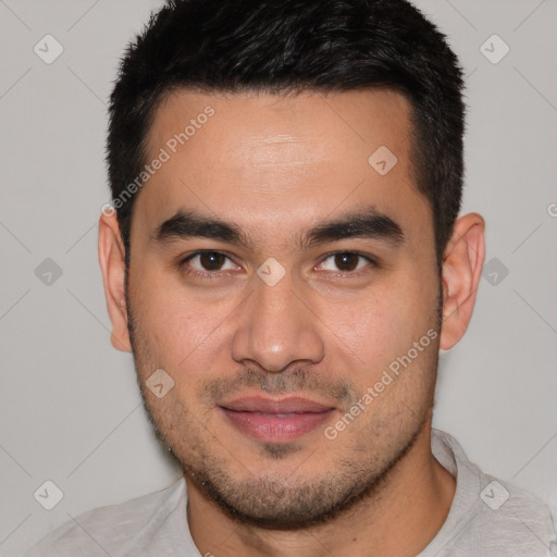 Joyful white young-adult male with short  black hair and brown eyes