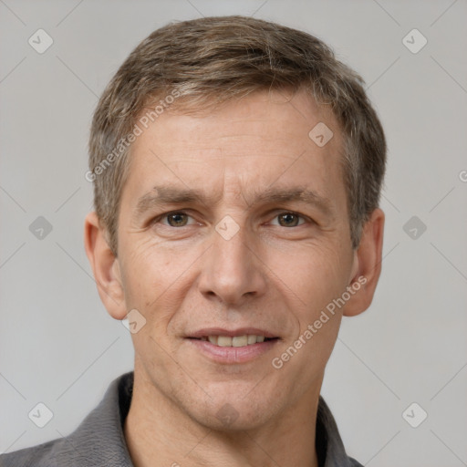 Joyful white adult male with short  brown hair and grey eyes