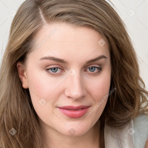 Joyful white young-adult female with long  brown hair and blue eyes