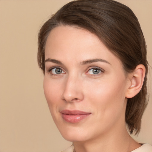 Joyful white young-adult female with medium  brown hair and grey eyes