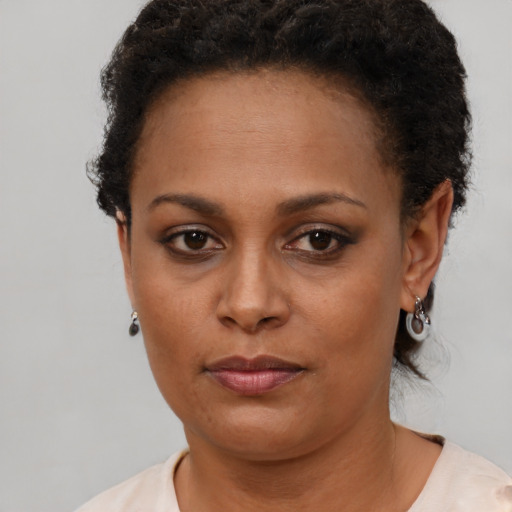 Neutral black young-adult female with short  brown hair and brown eyes