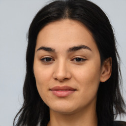 Joyful asian young-adult female with long  brown hair and brown eyes