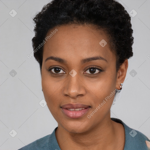 Joyful black young-adult female with short  black hair and brown eyes