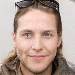 Joyful white adult male with short  brown hair and grey eyes