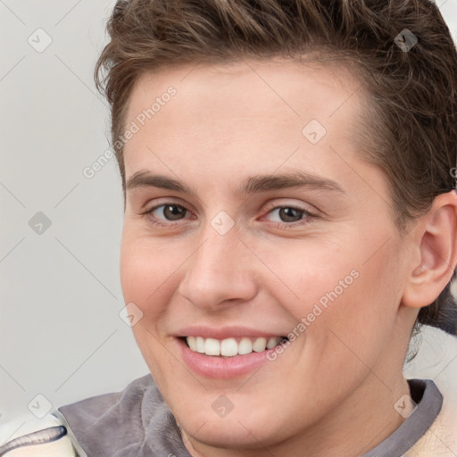 Joyful white young-adult female with short  brown hair and grey eyes