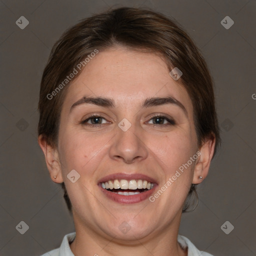 Joyful white adult female with short  brown hair and brown eyes