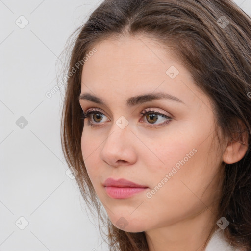 Neutral white young-adult female with long  brown hair and brown eyes