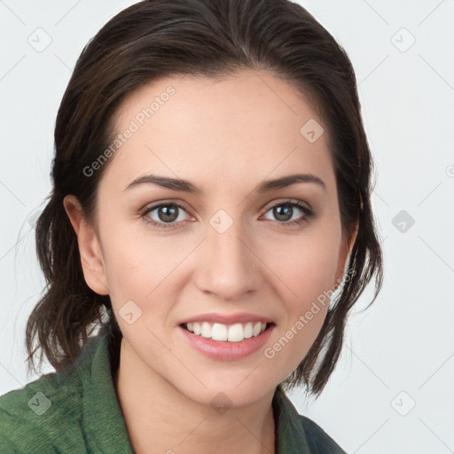 Joyful white young-adult female with medium  brown hair and green eyes