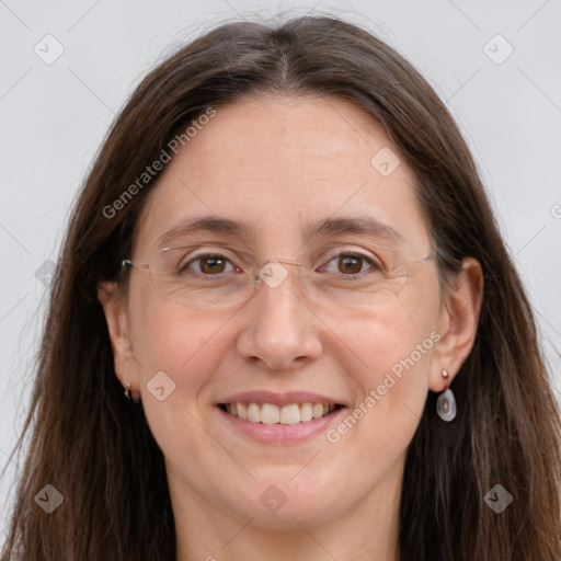 Joyful white adult female with long  brown hair and grey eyes