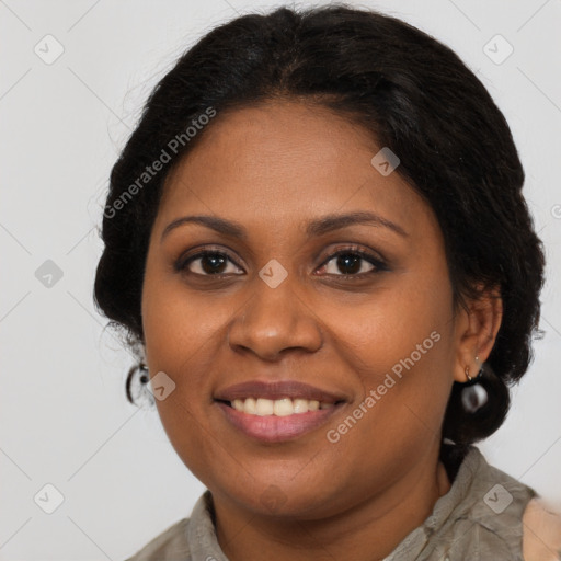 Joyful black young-adult female with long  brown hair and brown eyes