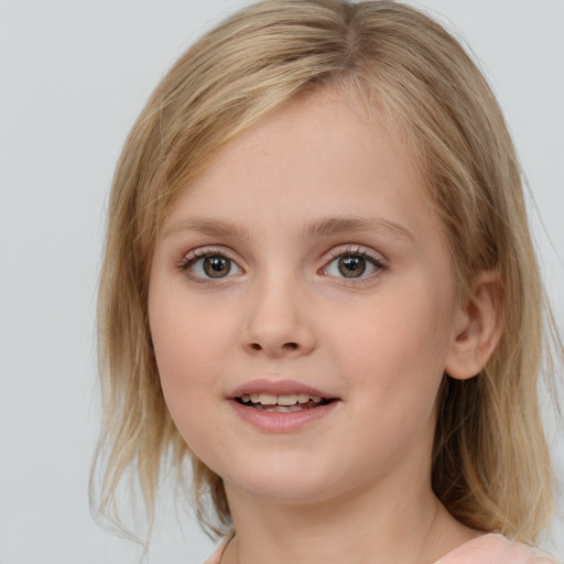 Joyful white child female with medium  brown hair and blue eyes