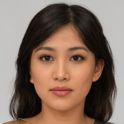 Neutral asian young-adult female with medium  brown hair and brown eyes