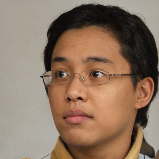 Neutral asian young-adult male with short  brown hair and brown eyes