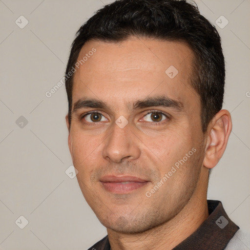 Joyful white adult male with short  brown hair and brown eyes