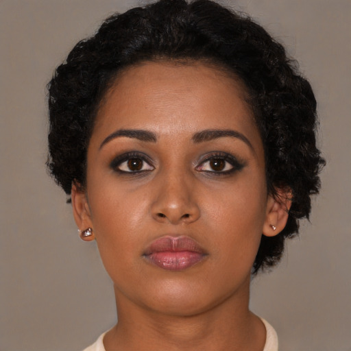 Neutral black young-adult female with short  black hair and brown eyes
