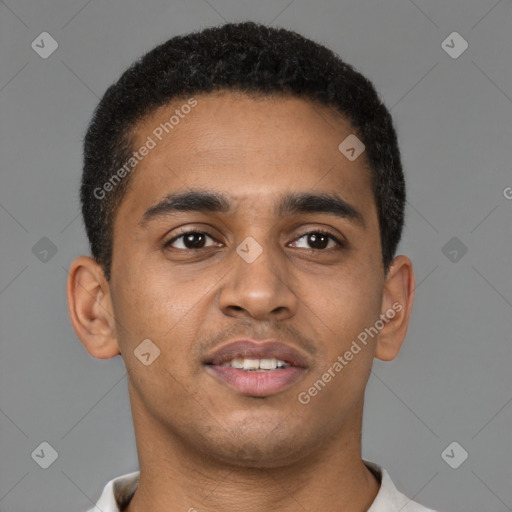 Joyful black young-adult male with short  brown hair and brown eyes